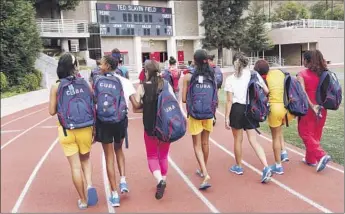  ?? Mel Melcon
Los Angeles Times ?? MEMBERS OF the Cuban delegation to the Special Olympics arrive at Harvard-Westlake High School in Studio City to practice. Studio City is hosting the team and raised money to cover the team’s expenses.