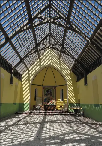  ?? Photos by Declan Malone ?? Seipéal Caitlín Naofa lies open to the blue sky on Monday as re-roofing work continued. RIGHT (top): Inch Constructi­on workers Ian Foley and Eoin Devane laying down new pressure-treated battens on the roof. RIGHT (bottom) Re-roofing work progressin­g in...