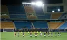  ??  ?? Cádiz and Osasuna players hold a minute’s silence at the empty Carranza stadium. Photograph: Fran Santiago/Getty