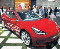  ?? PATRICK T. FALLON/BLOOMBERG FILE PHOTO ?? Tesla has repeatedly missed production targets for its Model 3, adding to billions of dollars of ongoing losses.