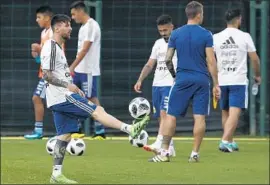  ?? Manu Fernandez Associated Press ?? ARGENTINE soccer star Lionel Messi, front, practices in Spain. Last week, protesters marched on the site to demand that his team boycott a game with Israel.