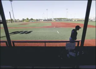  ?? Associated Press ?? FIELD LIFE — Marshall Rich leaves the field following a workout at Grand Park on Friday in Westfield, Indiana. Proceeds from the event will go to Reviving Baseball in the Inner City of Indianapol­is.