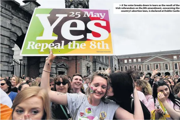  ??  ?? > A Yes voter breaks down in tears as the result of the Irish referendum on the 8th amendment, concerning the country’s abortion laws, is declared at Dublin Castle