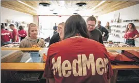  ?? Ricardo DeAratanha Los Angeles Times ?? THE CHECKOUT COUNTER at a MedMen dispensary in Venice, which has already hit the maximum number of shops allowed: four, based on its population.