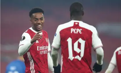  ??  ?? Joe Willock and Nicolas Pépé of Arsenal celebrate following Molde’s second own goal. Photograph: Marc Atkins/Getty Images