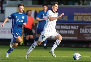  ?? ?? Chris Mochrie runs at the Peterhead defence. Photo: Craig Brown