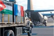  ?? ETAT MAJOR DES ARMEES VIA AP ?? Containers are loaded Thursday into a C-130 military aircraft on a French military airbase in Jordan.