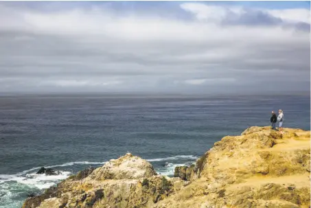  ?? Photos by Gabrielle Lurie / The Chronicle ?? Dale Ruyle (left) and Jace Rash look out at the ocean from Bodega Head in Bodega Bay, home to whales and other marine life.