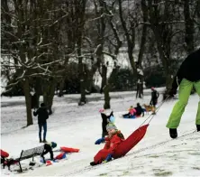  ?? Picture: Jeff J Mitchell/ Getty ?? Members of the public were sledding in Queen’s Park amid the snow