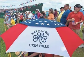  ?? / MILWAUKEE JOURNAL SENTINEL ?? Fans line the 18th hole during the third round of the U.S. Open Saturday at Erin Hills.