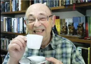  ?? (Photos: Courtesy) ?? THE WRITER enjoys a proper British cup of tea in his home in Israel.