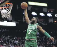  ?? DAVID J. PHILLIP - THE ASSOCIATED PRESS ?? FILE - In this Feb. 11, 2020, file photo, Boston Celtics’ Jaylen Brown goes up to dunk against the Houston Rockets during the second half of an NBA basketball game in Houston.