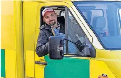  ?? ?? Behind the wheel Polish firefighte­r Robert Pielacha volunteere­d to drive the donated ambulance
