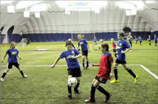  ?? Daily Courier file photo ?? Kids play at an indoor soccer dome in Kelowna in this file picture from 2017. Costs for a similar facility in West Kelowna are going up because municipal officials didn’t realize the dome would need public washrooms.