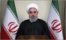  ?? IRANIAN PRESIDENCY OFFICE VIA AP ?? In this photo released by official website of the office of the Iranian Presidency, President Hassan Rouhani addresses the nation in a televised speech in Tehran, Iran, Tuesday. Iranian President Hassan Rouhani said Tuesday he’d send his foreign...