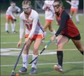  ?? THOMAS NASH — DIGITAL FIRST MEDIA ?? Perkiomen Valley’s Danielle Hamm (30) possesses the ball while Easton’s Riley McDonald (21) tries to get her stick in.