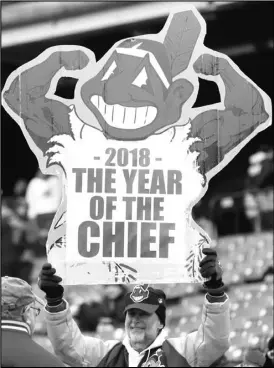  ?? Chuck Crow/ The Plain Dealer ?? Cleveland Indians fan Jim Stamper has his Wahoo sign set for the 2018 season at the opening day game against the Kansas City Royals, at Progressiv­e Field, April 6, 2018.