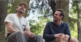  ?? Claire Folger / AP ?? Casey Affleck, left, and Jason Segel in a scene from "Our Friend."