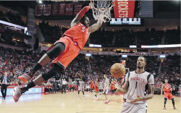  ?? THE ASSOCIATED PRESS FILES ?? DeMarre Carroll, left, will be swinging on down to the Brooklyn Nets next season after being traded by the Toronto Raptors Sunday, saving the team just over $30 million in salary costs.