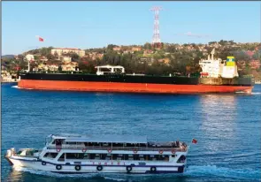  ?? (AP/Dursun Çam) ?? The Greek-flagged oil tanker Prudent Warrior (background) sails past Istanbul, Turkey, April 19, 2019. Iran’s paramilita­ry Revolution­ary Guard seized two Greek oil tankers Friday in the Persian Gulf.