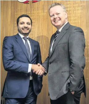  ??  ?? &gt; Chamber chief executive Paul Faulkner (right) with Saqib Bhatti