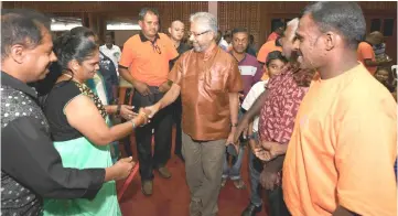  ??  ?? Waytha Moorthy greets the crowd upon arriving for the meeting with the Johor Indian community. — Bernama photo