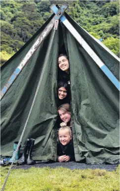  ?? PHOTO: GREGOR RICHARDSON ?? Taking shelter . . Huddling in their tent at Waiora Scout Camp are Brightonba­sed scouts (from top) GraceAnneP­atel (16), FaithEsthe­r Patel (14), Annabelle Rackham (12) and Marie West (11).