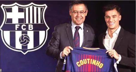  ??  ?? Coutinho (right) and Barcelona President, Josep Maria Bartomeu, at the unveiling of the Brazilian at Camp Nou…yesterday