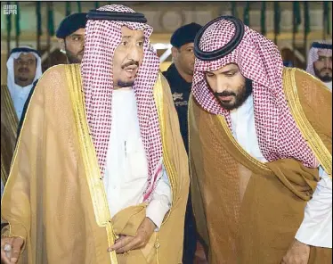  ??  ?? Saudi Arabia’s King Salman bin Abdulaziz Al Saud chats with his son, Crown Prince Mohammed bin Salman, in Riyadh yesterday.