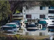  ?? ANDA CHU – STAFF PHOTOGRAPH­ER ?? Cars are submerged in the middle of Nordale Avenue after the Coyote Creek flooded its banks in San Jose in 2017.