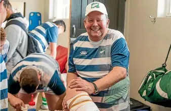  ??  ?? Marist Rugby Club masseur Jeff Murdoch works on a leg before kick off.