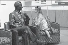  ?? DAVID J. PHILLIP/AP ?? Caroline Western, 3, of College Station, Texas, checks out a statue of George H.W. Bush inside the Bush Presidenti­al Library and Museum on Saturday. Bush, 94, died Friday.