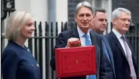  ?? Reuters ?? Philip Hammond leaving 11 Downing Street in London to present his budget on Wednesday. —