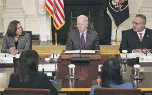  ?? SUSAN WALSH/AP ?? President Joe Biden convenes a meeting of the reproducti­ve rights task force in the State Dining Room of the White House on Tuesday. He is joined by Vice President Kamala Harris and Education Secretary Miguel Cardona.