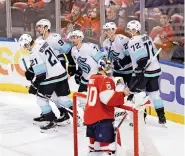  ?? DAVID SANTIAGO dsantiago@miamiheral­d.com ?? Seattle Kraken right wing Jordan Eberle (7) celebrates with teammates after beating Panthers goaltender Spencer Knight for a first period goal on Saturday in Sunrise.