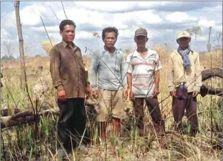  ?? ADHOC ?? Community members in Snuol district on land they allege has been systematic­ally grabbed and cleared by powerful interests.