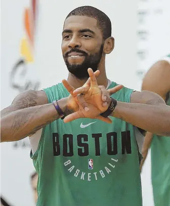  ?? STAFF FILE PHOTO BY NANCY LANE ?? WORKING OUT THE KINKS: Kyrie Irving and his Celtics teammates are trying to play a bit of catch-up amid a condensed schedule that has left little time for practice.