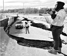  ?? REUTERS ?? A stranded vehicle lies on a collapsed highway near the airport after an earthquake in Anchorage, Alaska, US on Friday
