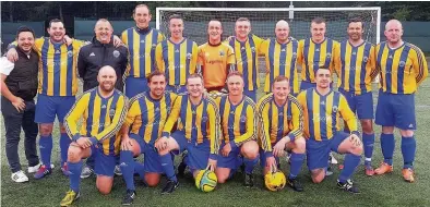  ??  ?? Looking the business EKYM 35s’ players and coaches with their new kit provided by Zucca owner Yaccine Titi, far left