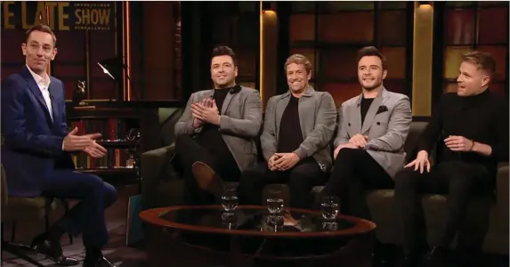  ??  ?? Westlife on The Late Late Show last Friday with host, Ryan Tubridy. (Below) Shane Filan signing with Westlife on the show.