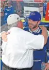  ?? THE ASSOCIATED PRESS ?? Jimmie Johnson, right, hugs team owner Rick Hendrick in victory lane after winning Sunday’s NASCAR Cup Series race at Dover Internatio­nal Speedway.