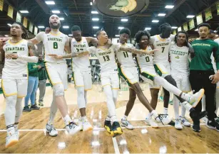  ?? BILLY SCHUERMAN/STAFF ?? Norfolk State players dance to the school fight song after the Spartans defeated the Purdue Fort Wayne Mastodons on Wednesday in the CIT championsh­ip game at Echols Hall.