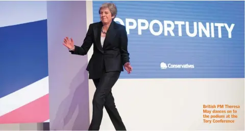  ??  ?? British PM Theresa May dances on to the podium at the Tory Conference