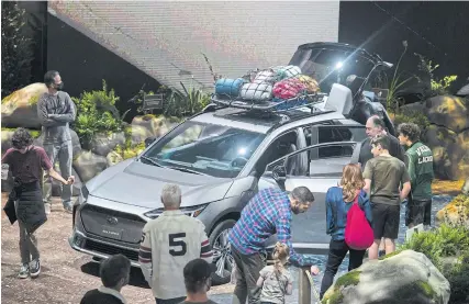  ?? BLOOMBERG ?? Attendees view the Solterra, Subaru’s first all-electric SUV developed with Toyota Motor Corp, during the opening day of the 2022 New York Internatio­nal Auto Show on April 15.