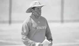  ?? JOHN MCCALL/SOUTH FLORIDA SUN SENTINEL ?? Hurricanes coach Manny Diaz watches the Under Armour All-America Camp Series in Miami on March 7.