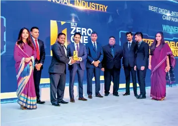  ??  ?? DGM Marketing of CDB Darshana Jayasinghe being presented the award for the Best Digital Integrated Campaign at the SLT Zero One Awards for CDBiNet