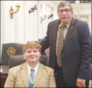  ?? Photo by Tricia Pemberton ?? Heavener High School senior Sean Miller, seated, got to be a page all last week for District 3 State Rep. Rick West.