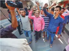  ?? PTI ?? Relatives of victims of Friday’s train accident chant anti-government slogans at a railway crossing near the accident site in Amritsar yesterday.