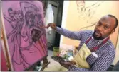  ?? PIUS UTOMI EKPEI / AFP ?? Oliver Enwonwu, president of the Society of Nigerian Artists and son of late Professor Ben Enwonwu, paints a drawing at his Omenka studio in Lagos, on Feb 19.