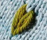  ??  ?? The little leaves are formed by drawing yarn up through stitches on the rows below